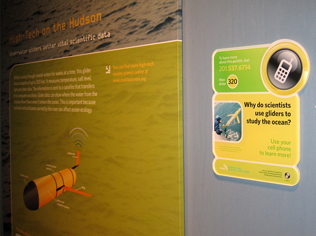 Visitors to the Liberty Science Center can hear oceanographers talk about this underwater robot glider through their cell phones. Credit: Kate Florio.